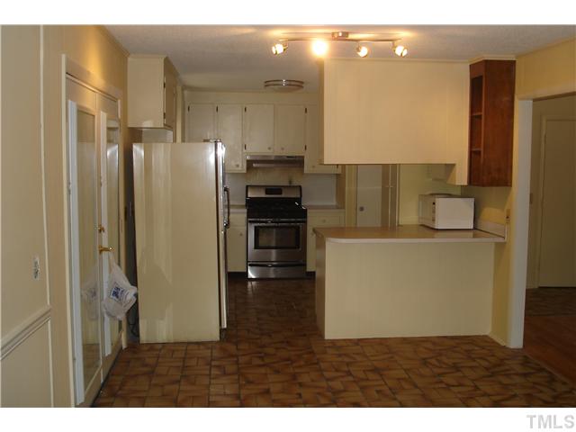 811 Springview Trail Garner, NC 27529 - Photo 3 of 13 All appliances convey. French doors lead to covered deck