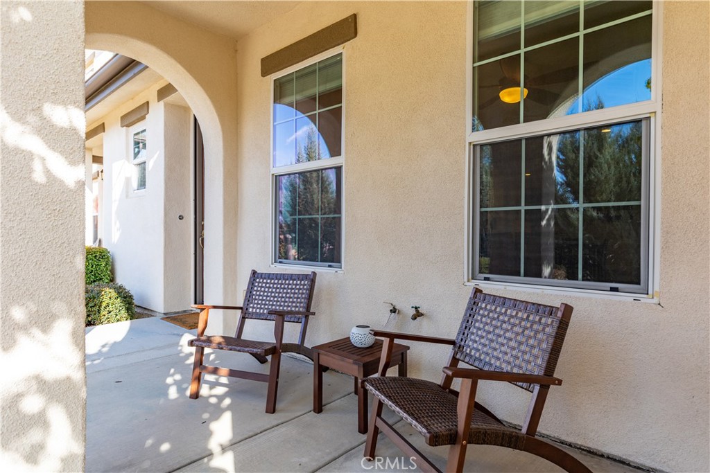 9354 Riberena Circle Atascadero, CA 93422 - Photo 2 of 47 a view of a chair and table in a balcony
