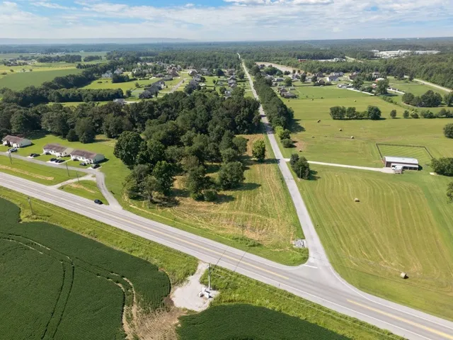 a view of a swimming pool with a yard