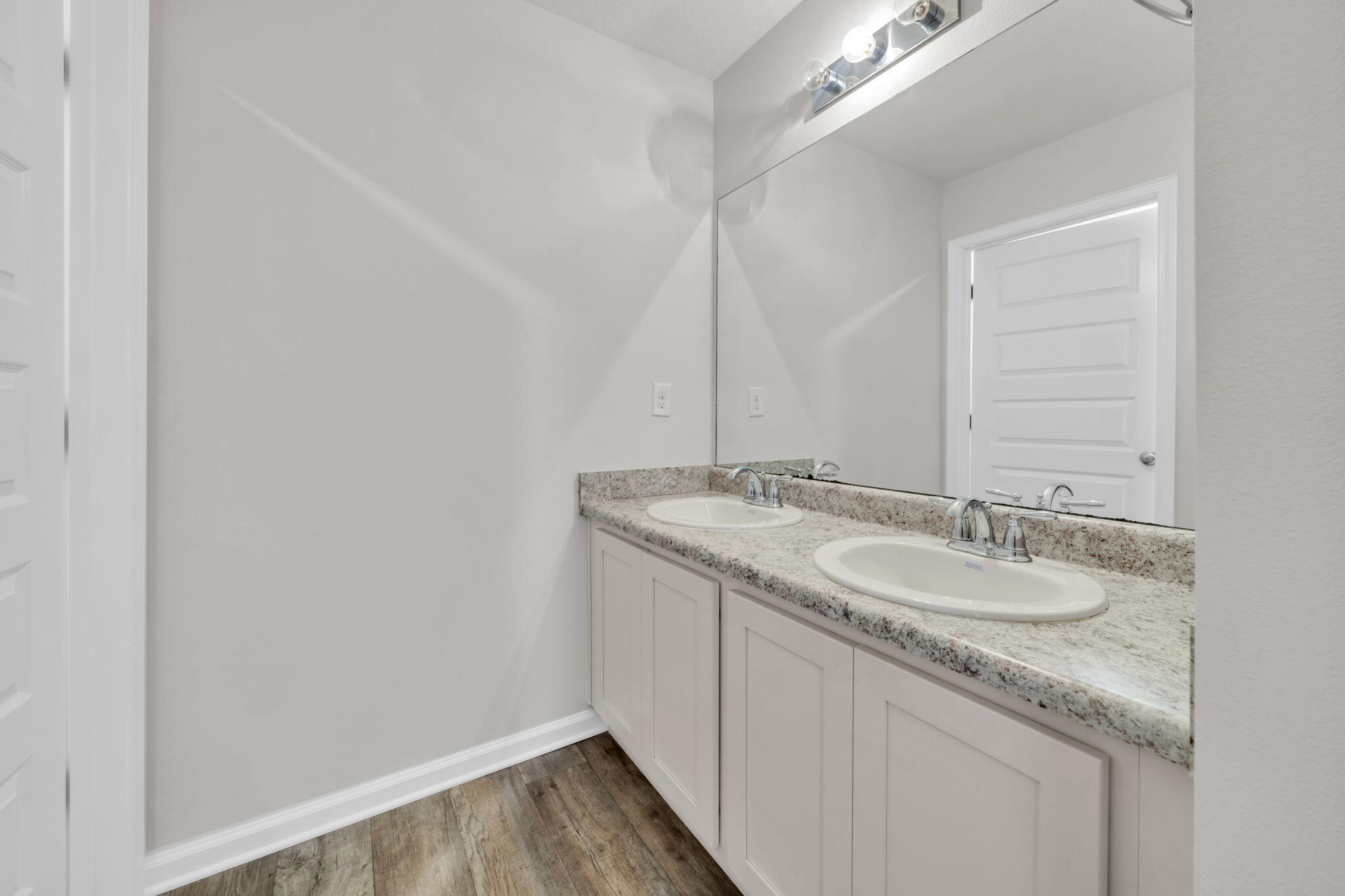 305 This Way Freeport, FL 32439 - Photo 26 of 48 a bathroom with a granite countertop sink and a mirror