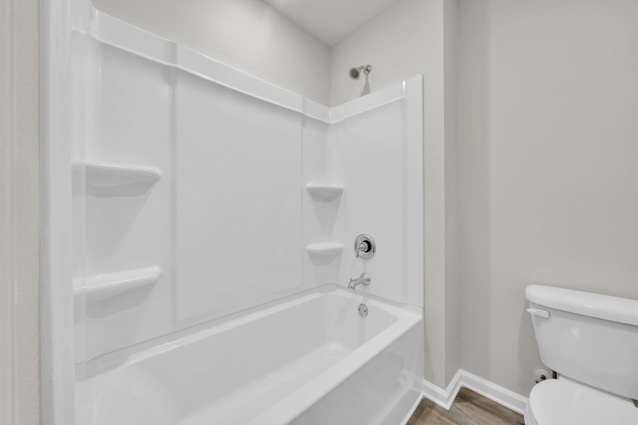 305 This Way Freeport, FL 32439 - Photo 27 of 48 a bathroom with a bathtub and a toilet