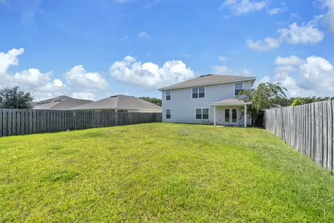 a swimming pool with wooden fence