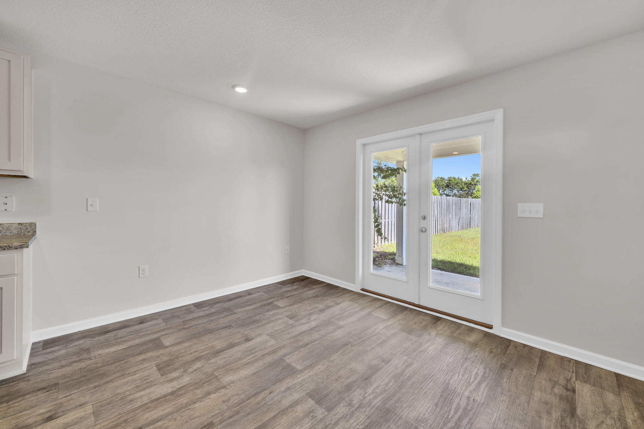 305 This Way Freeport, FL 32439 - Photo 9 of 48 an empty room with sliding door