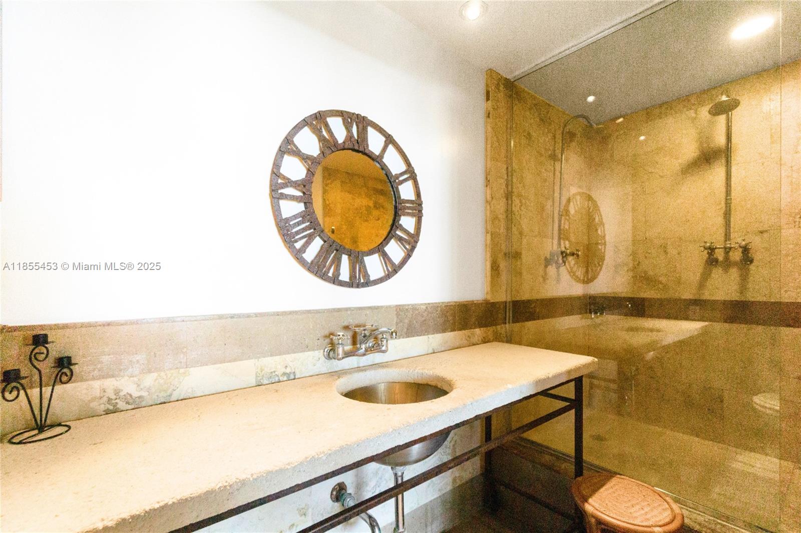 100 Lincoln Road, Unit PH8 Miami Beach, FL 33139 - Photo 21 of 37 a bathroom with a sink and a mirror