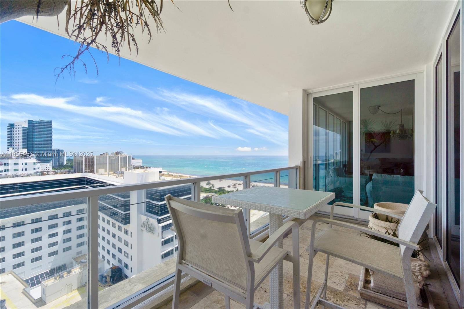 100 Lincoln Road, Unit PH8 Miami Beach, FL 33139 - Photo 23 of 37 a view of a table and chairs in patio
