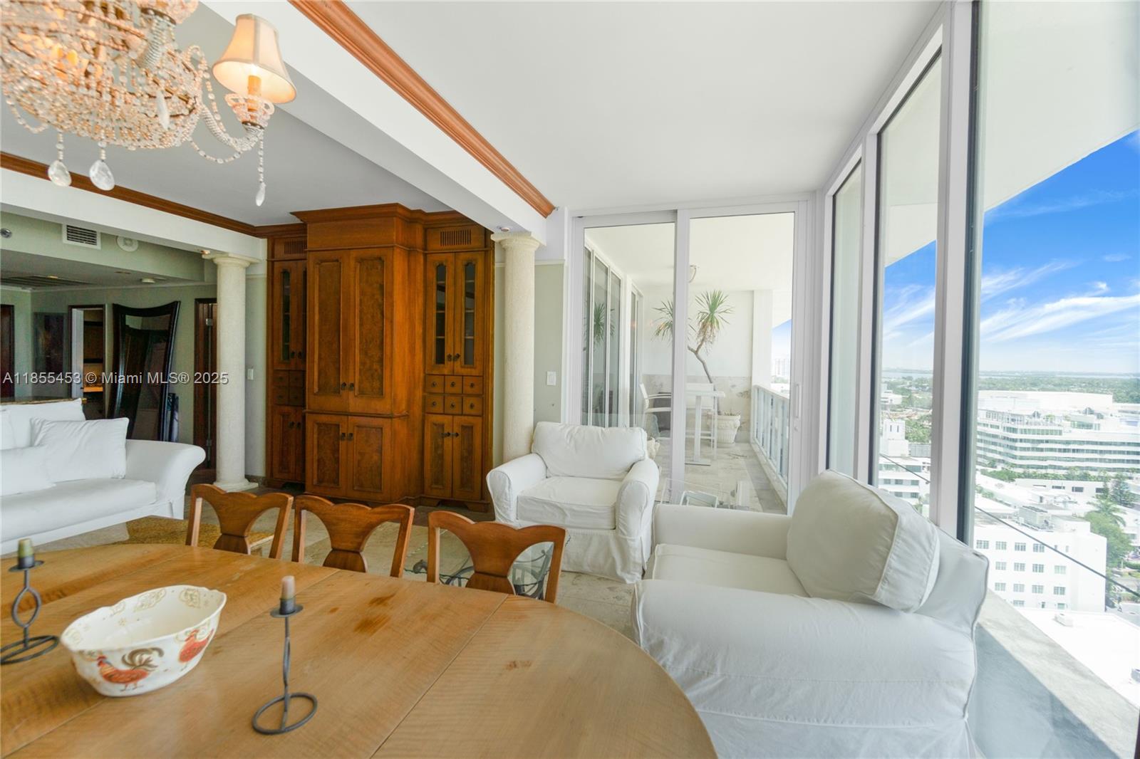 100 Lincoln Road, Unit PH8 Miami Beach, FL 33139 - Photo 8 of 37 a living room with furniture and a large window