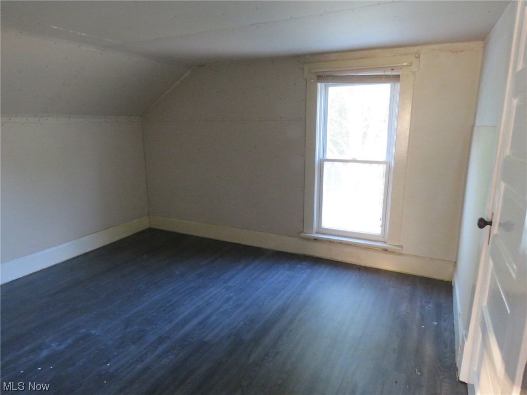 10451 Lagrange Road Elyria, OH 44035 - Photo 19 of 21 Bedroom with a healthy amount of sunlight, dark hardwood / wood-style flooring, and vaulted ceiling