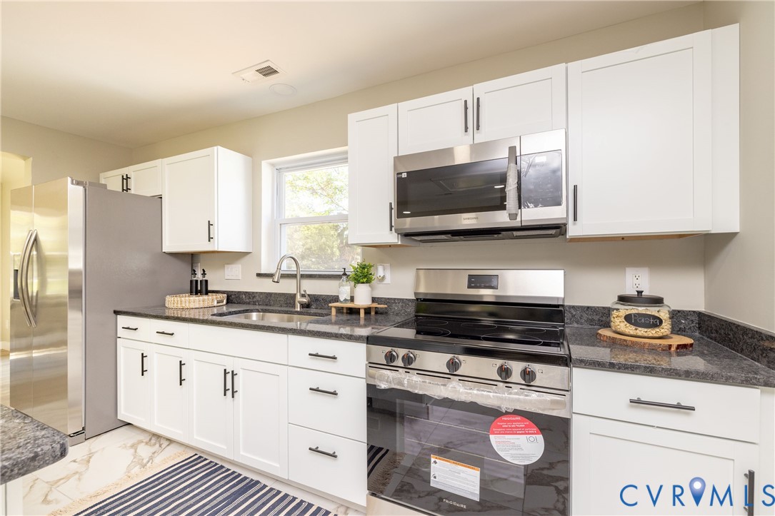 7272 Willson Road Henrico, VA 23231 - Photo 1 of 47 Kitchen featuring stainless steel appliances, whit