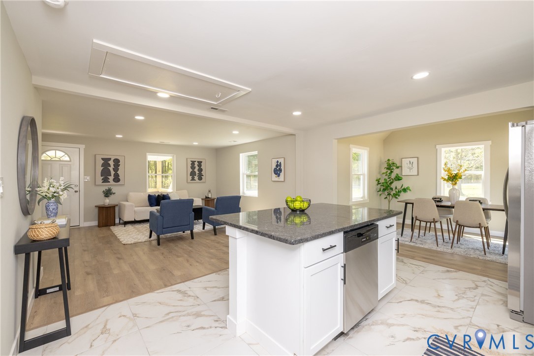7272 Willson Road Henrico, VA 23231 - Photo 46 of 47 a kitchen with stainless steel appliances kitchen island granite countertop dining room cabinets and living room