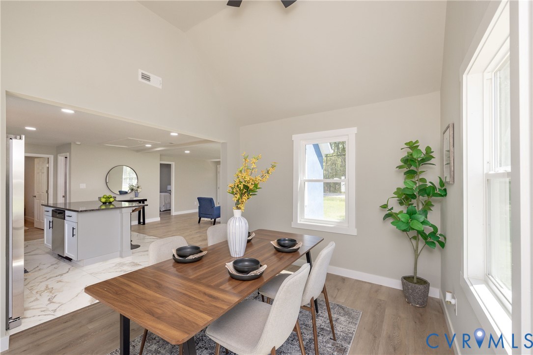 7272 Willson Road Henrico, VA 23231 - Photo 17 of 47 Dining area with high vaulted ceiling and baseboar