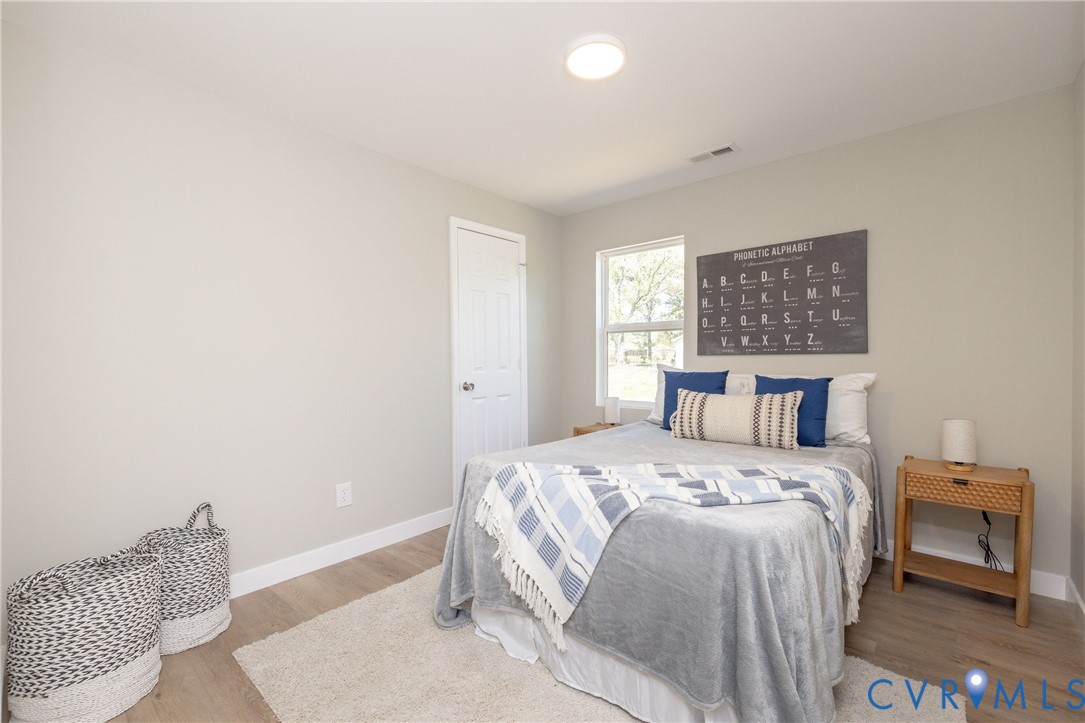 7272 Willson Road Henrico, VA 23231 - Photo 19 of 47 a bedroom with a bed and a window