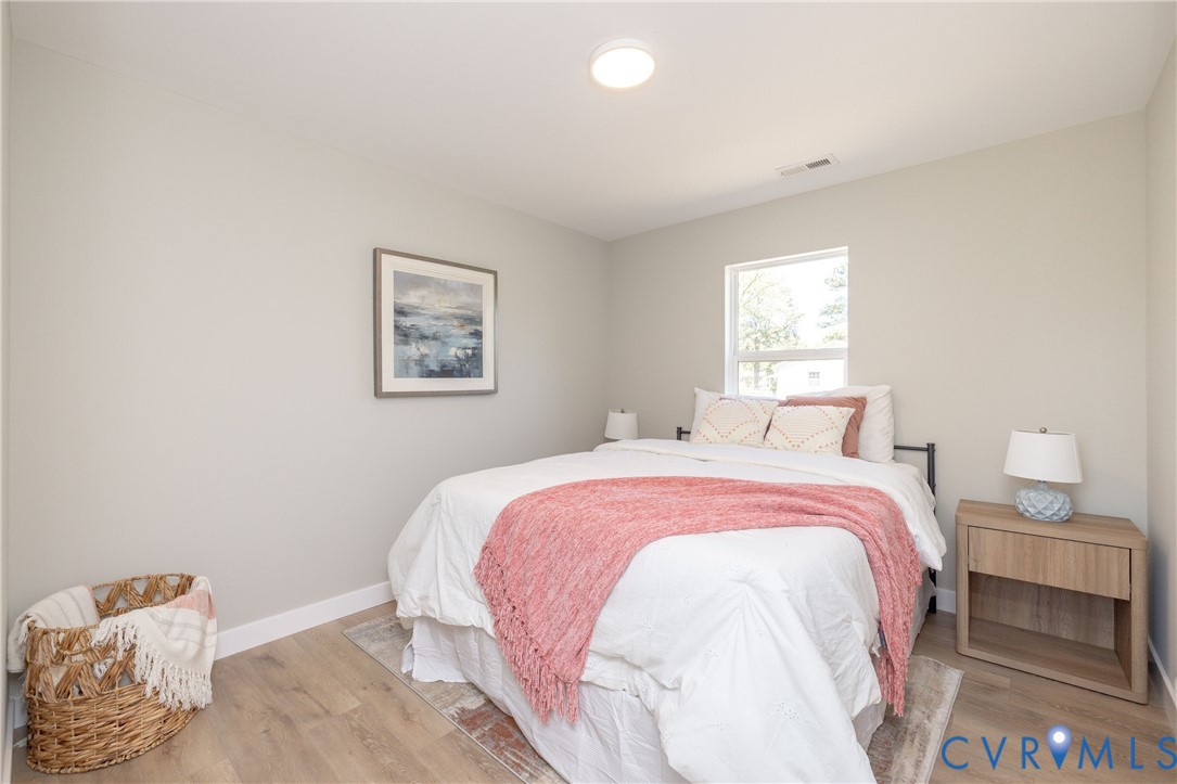 7272 Willson Road Henrico, VA 23231 - Photo 24 of 47 Bedroom with light wood-type flooring and baseboar
