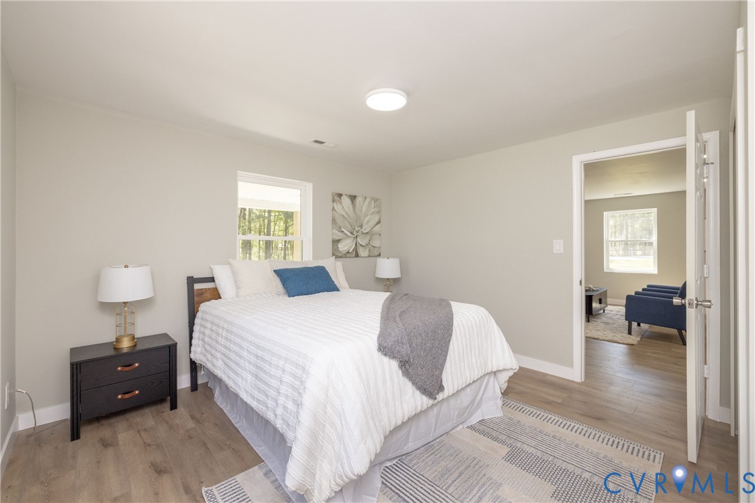 7272 Willson Road Henrico, VA 23231 - Photo 28 of 47 Bedroom featuring light wood-type flooring and bas