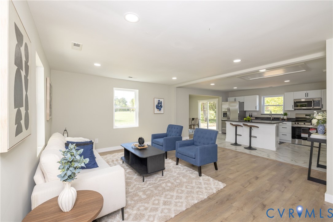 7272 Willson Road Henrico, VA 23231 - Photo 3 of 47 a living room with furniture and a wooden floor