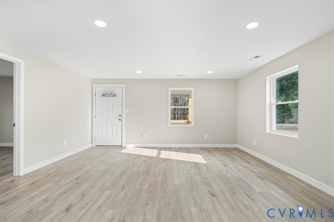 7272 Willson Road Henrico, VA 23231 - Photo 38 of 47 an empty room with wooden floor and windows