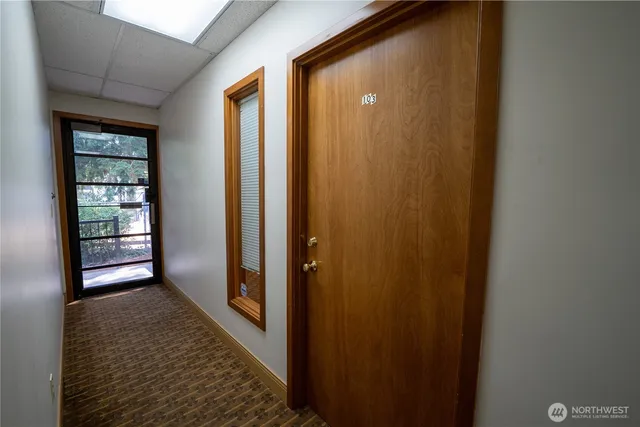 a view of hallway with windows