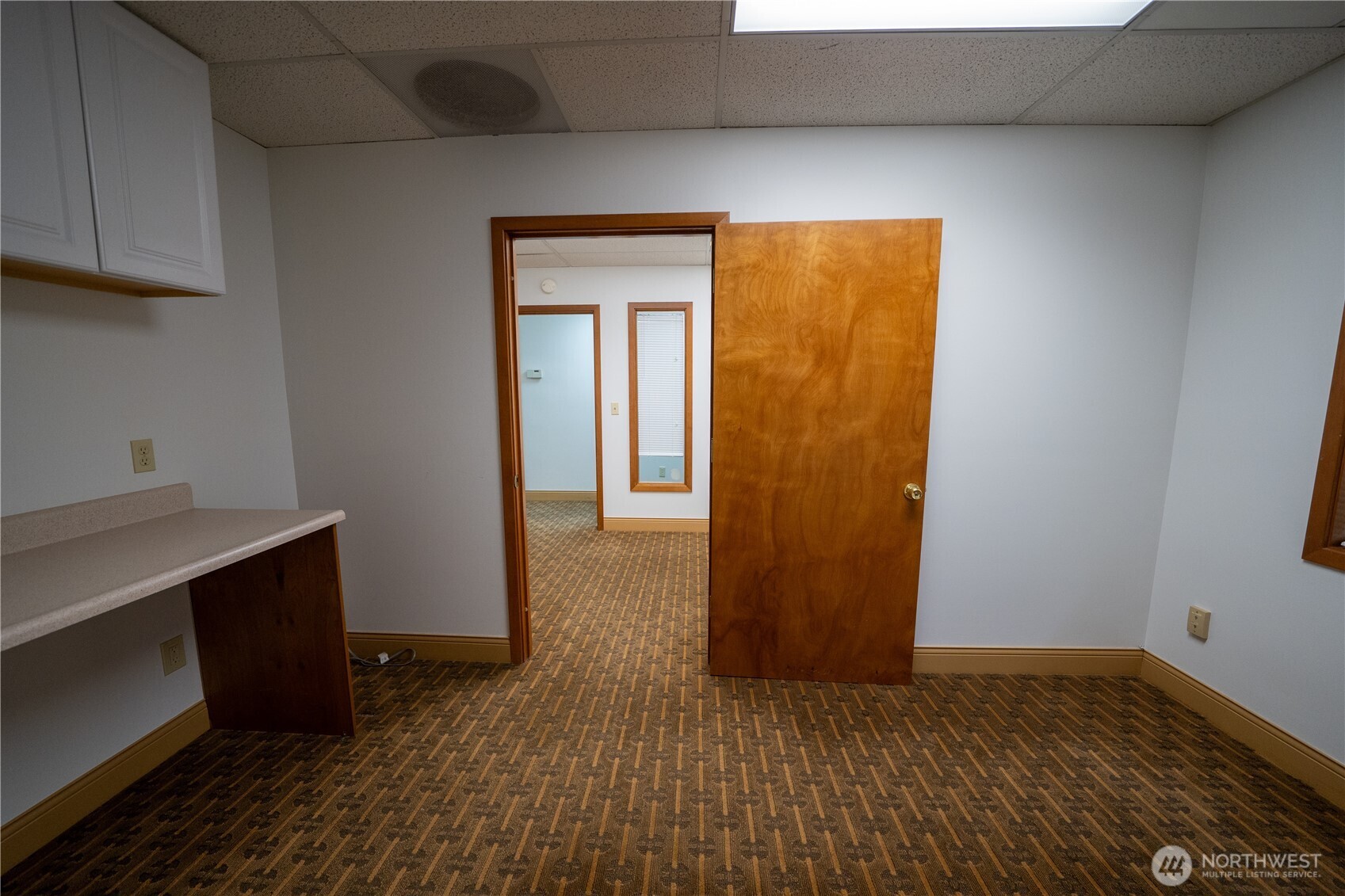 11201 Southeast Kent-Kangley Road, Unit 103 Kent, WA 98030 - Photo 5 of 9 a view of hallway with wooden floor