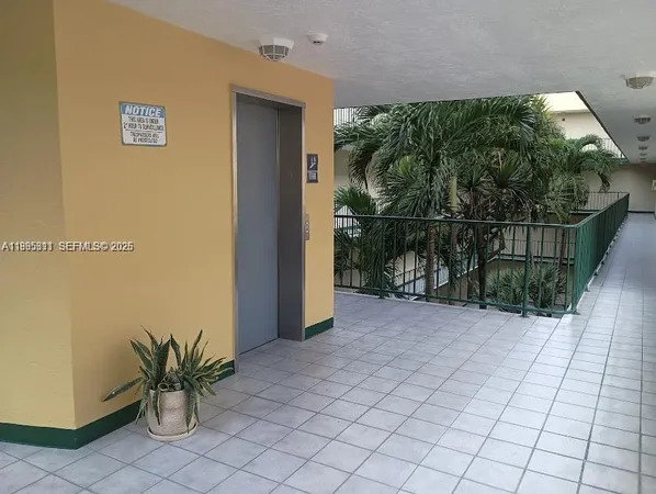 a view of balcony with small yard