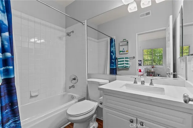 a bathroom with a sink a toilet and a bathtub