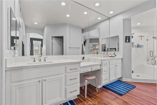 a large kitchen with cabinets a sink dishwasher a dining table and chairs