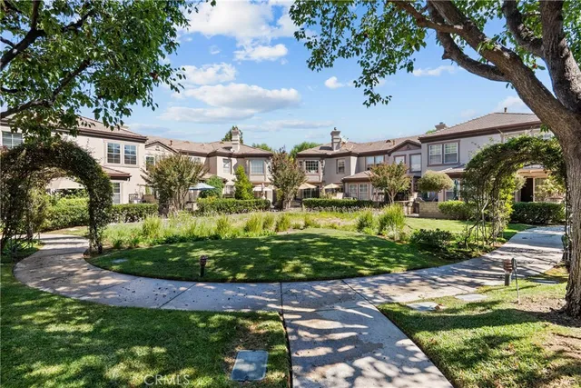 a view of yard with swimming pool and green space