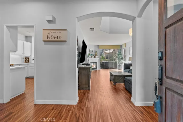 a view of a living room with a wooden floor