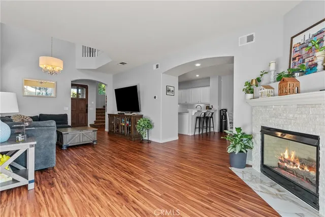 a living room with furniture and a fireplace or television
