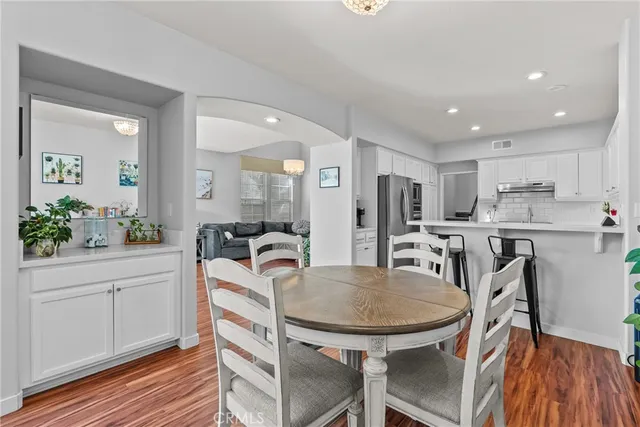 a kitchen with a table and chairs in it