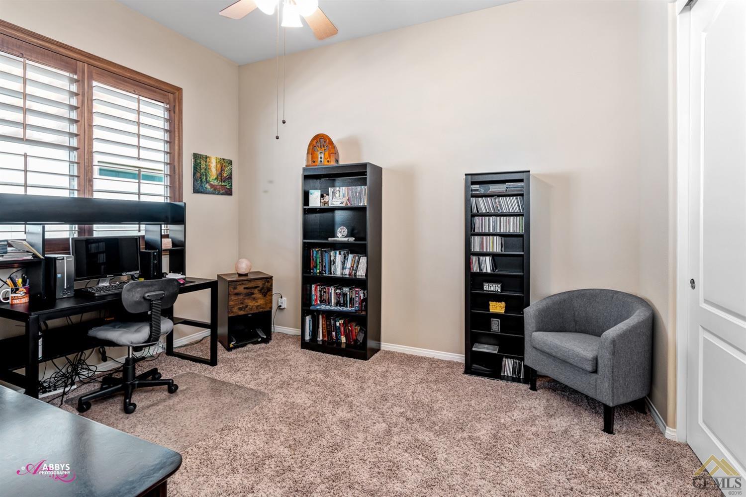 Undisclosed Address Bakersfield, CA 93306 - Photo 17 of 48 a livingroom with a workspace