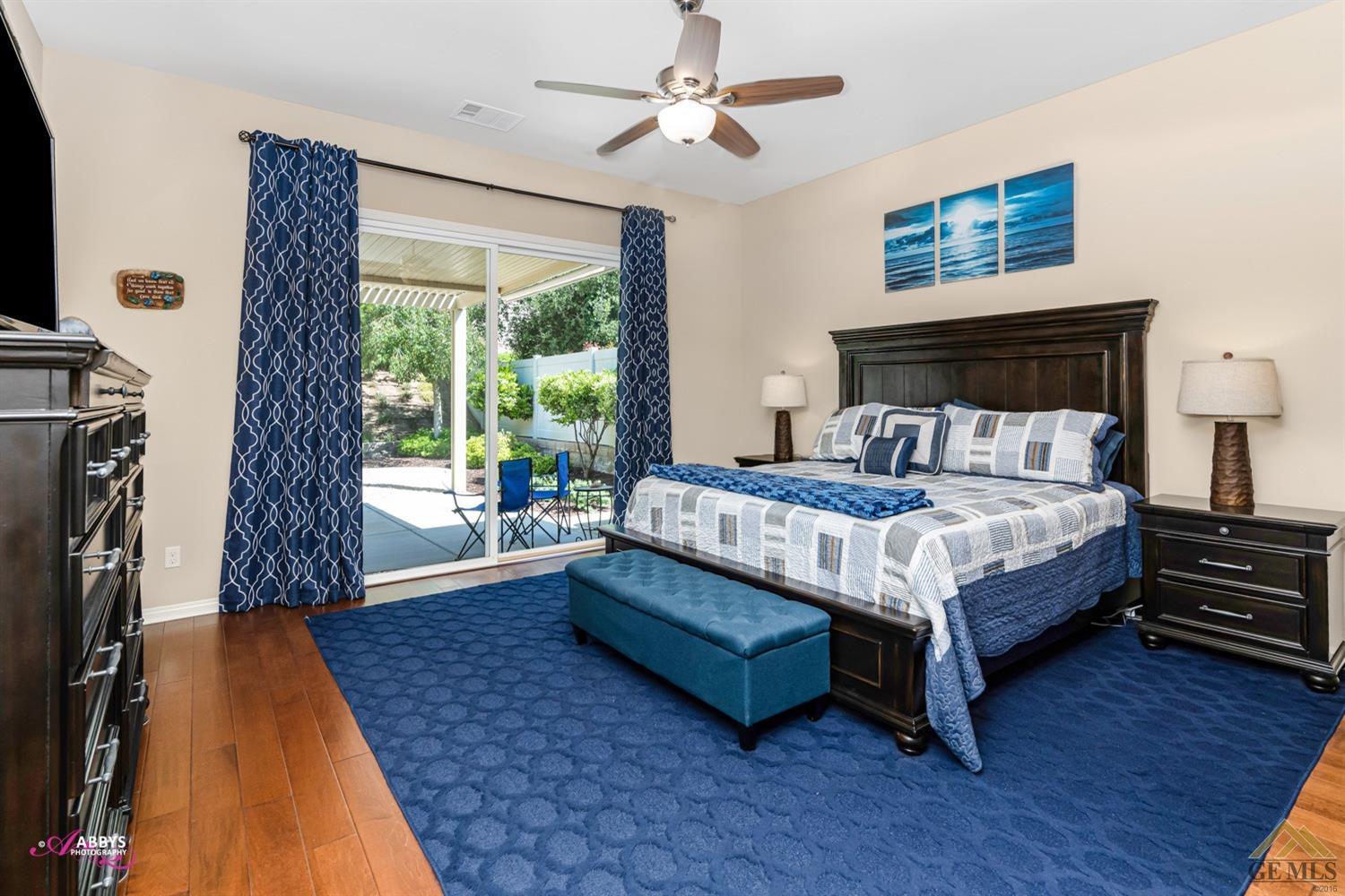 Undisclosed Address Bakersfield, CA 93306 - Photo 20 of 48 a bedroom with a bed wooden floor and window