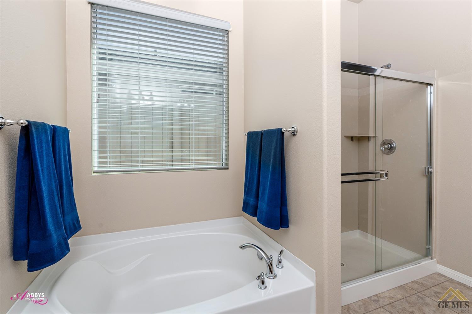 Undisclosed Address Bakersfield, CA 93306 - Photo 21 of 48 a white bath tub sitting next to a shower