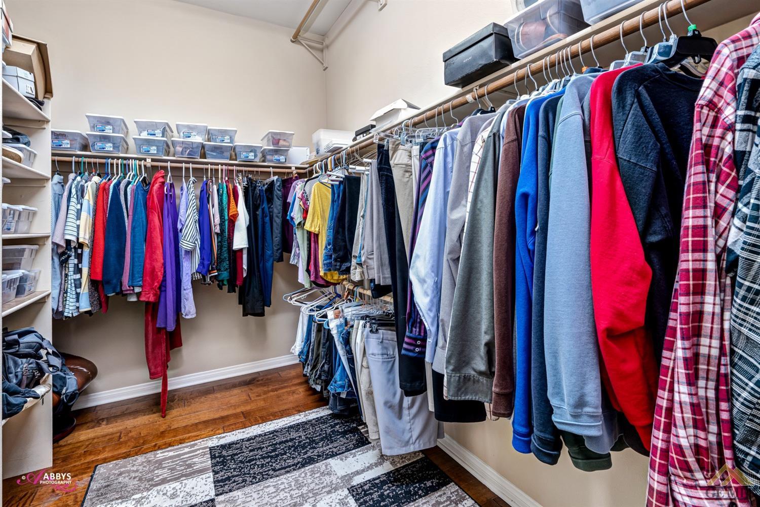 Undisclosed Address Bakersfield, CA 93306 - Photo 24 of 48 a view of walk in closet with clothes
