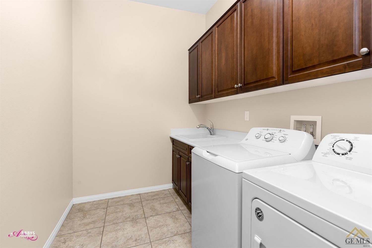 Undisclosed Address Bakersfield, CA 93306 - Photo 25 of 48 a utility room with dryer and washer