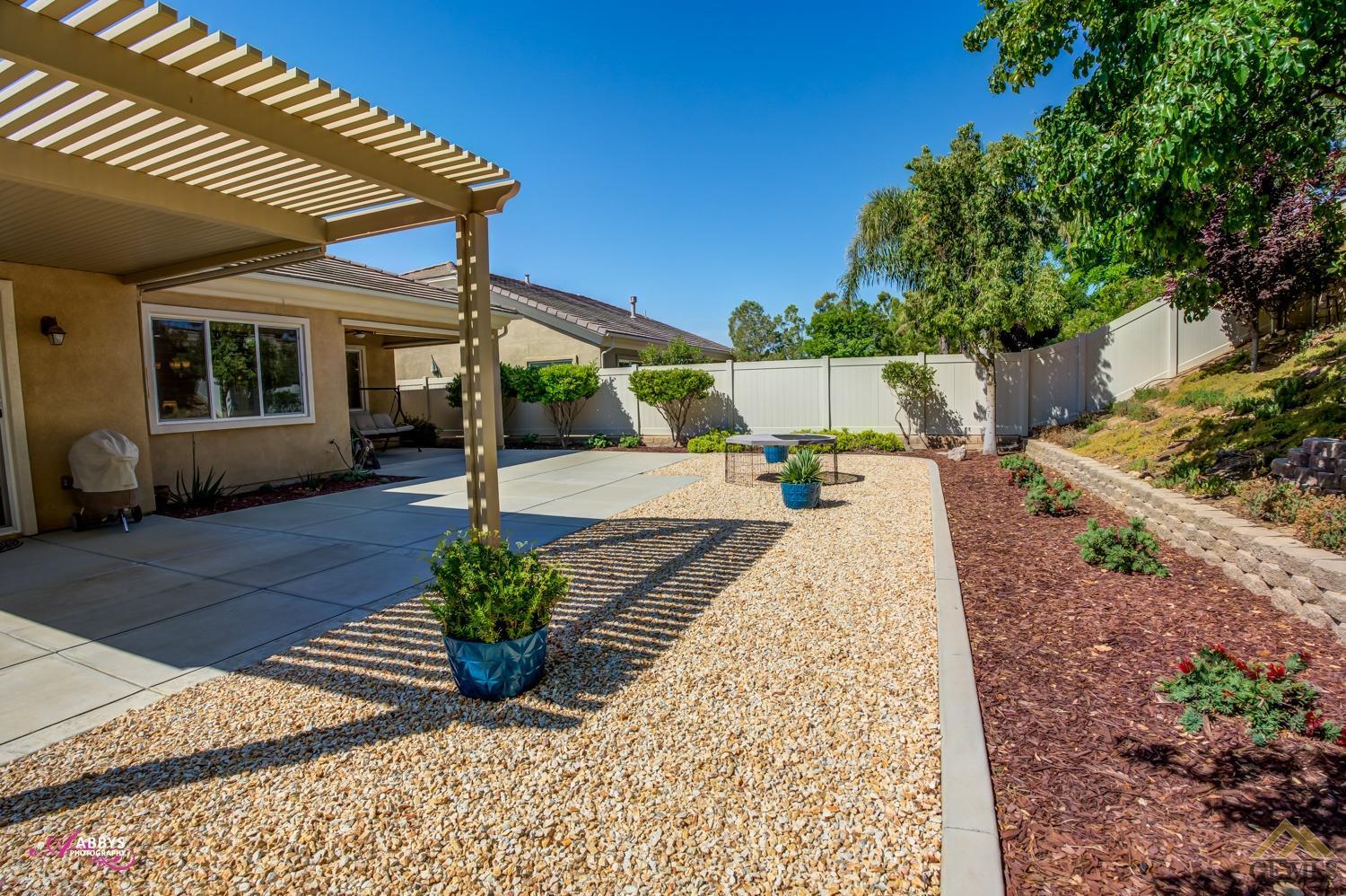 Undisclosed Address Bakersfield, CA 93306 - Photo 29 of 48 a view of a backyard with sitting area