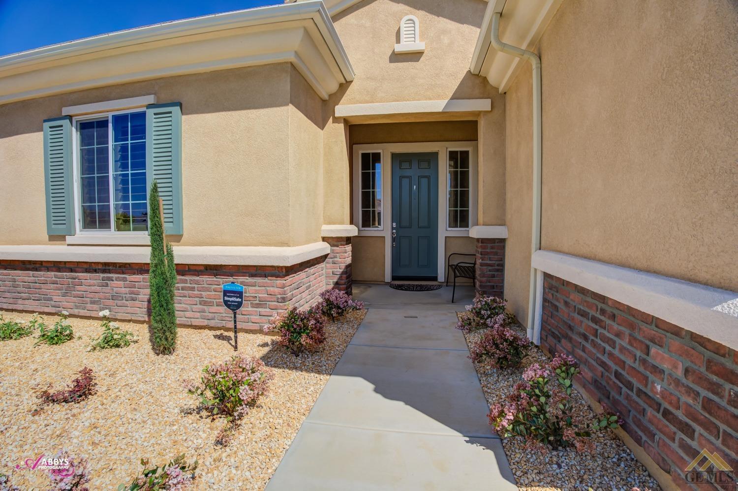 Undisclosed Address Bakersfield, CA 93306 - Photo 3 of 48 a front view of a house with patio