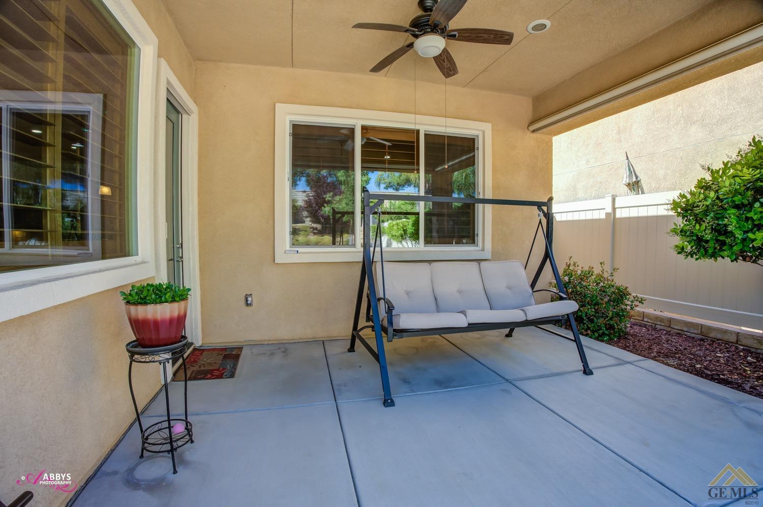 Undisclosed Address Bakersfield, CA 93306 - Photo 31 of 48 a living room with furniture and windows