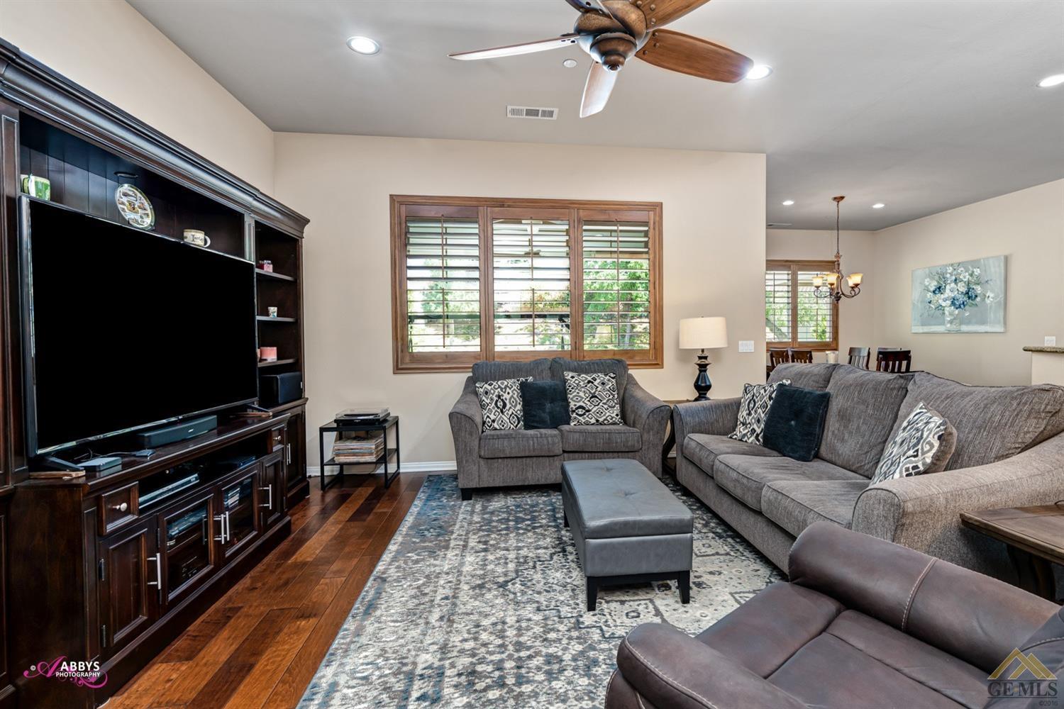 Undisclosed Address Bakersfield, CA 93306 - Photo 4 of 48 a living room with furniture and a flat screen tv