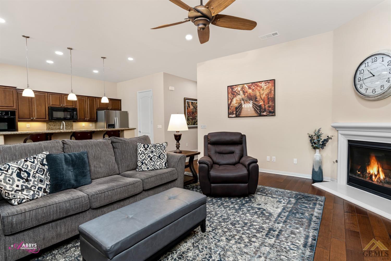 Undisclosed Address Bakersfield, CA 93306 - Photo 6 of 48 a living room with furniture and a fireplace