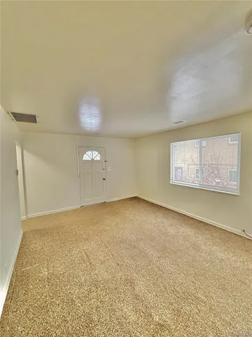 a kitchen with a sink cabinets and a refrigerator
