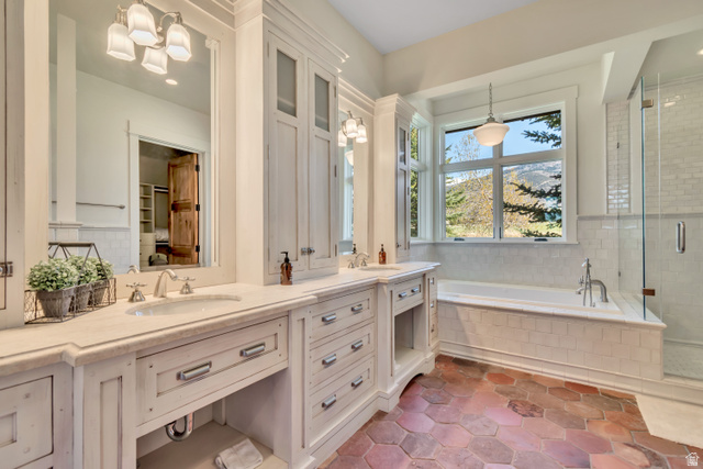 2579 Splendor Valley Road Kamas, UT 84036 - Photo 49 of 87 Bathroom with double vanity, a bath, a stall shower, and hanging lights