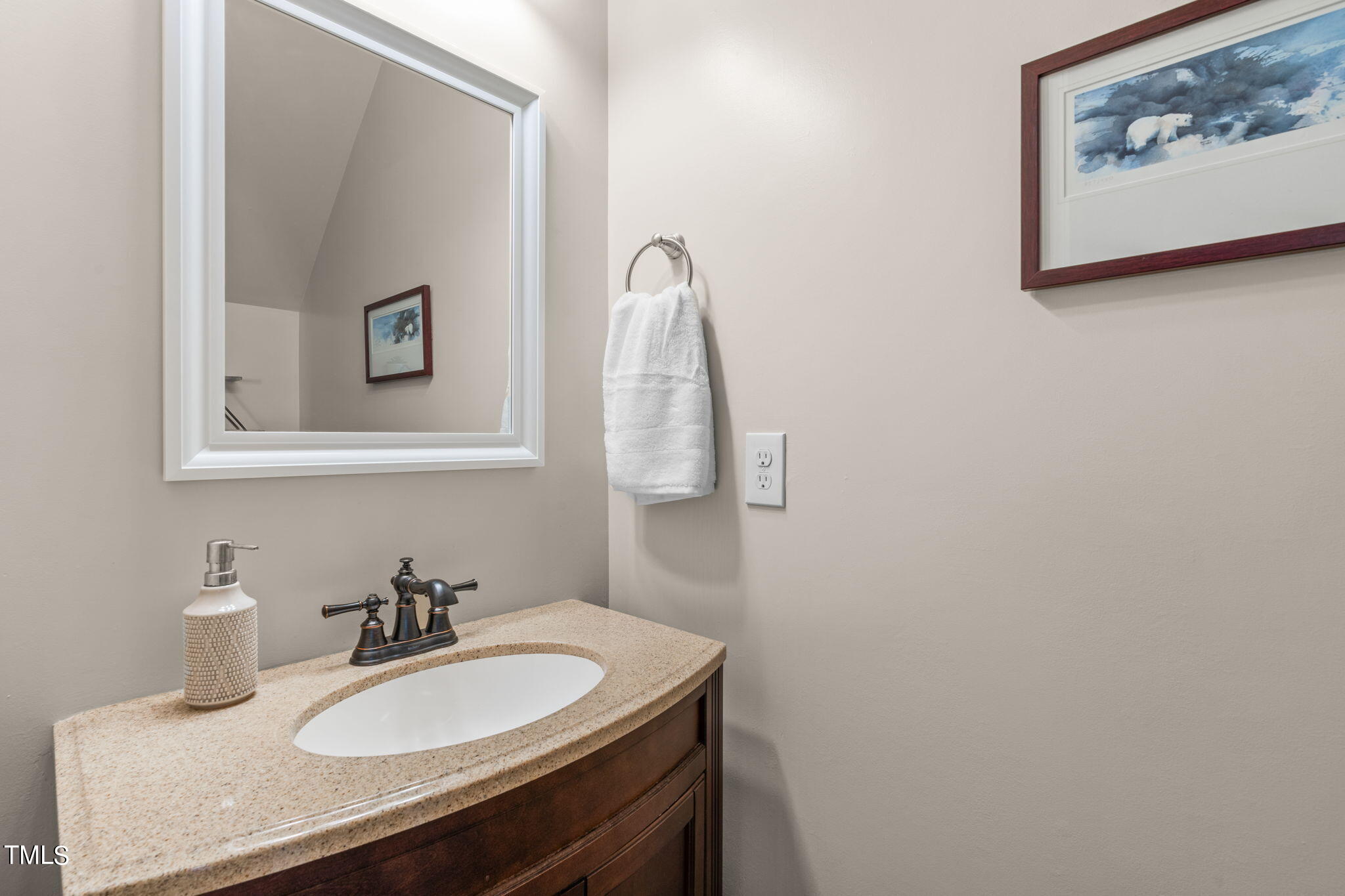 1307 Still Monument Way Raleigh, NC 27603 - Photo 13 of 40 a bathroom with a sink and a mirror
