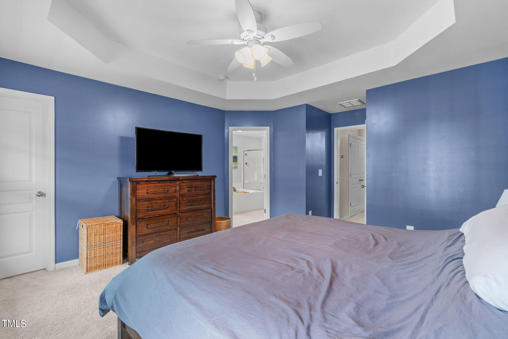 1307 Still Monument Way Raleigh, NC 27603 - Photo 17 of 40 a bedroom with a bed and a flat screen tv