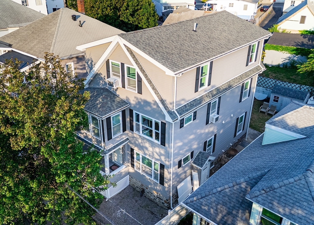 16 Mohan Street Everett, MA 02149 - Photo 35 of 35 a aerial view of a house next to a yard