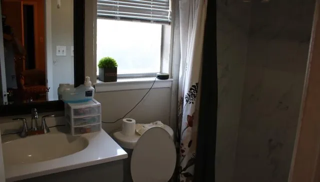 a bathroom with a sink and mirror