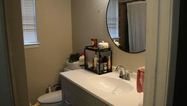 a bathroom with a sink and a mirror