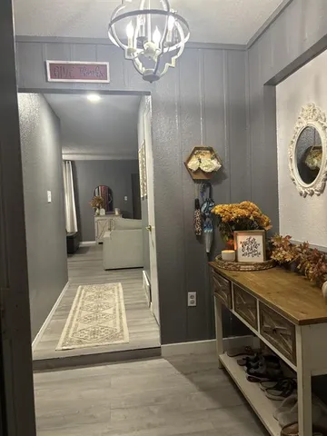 a room with a washing machine and cabinets