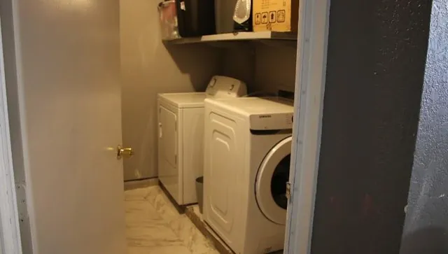 a utility room with dryer and washer