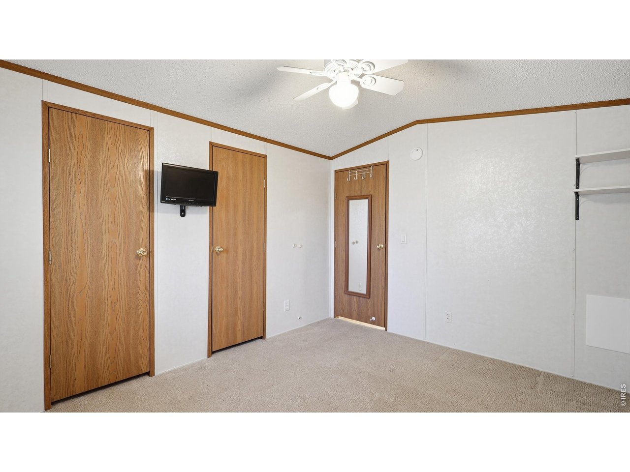 256 Navajo Road Weldona, CO 80653 - Photo 15 of 27 SPACIOUS CLOSET + TV