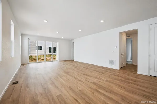 a view of house with backyard