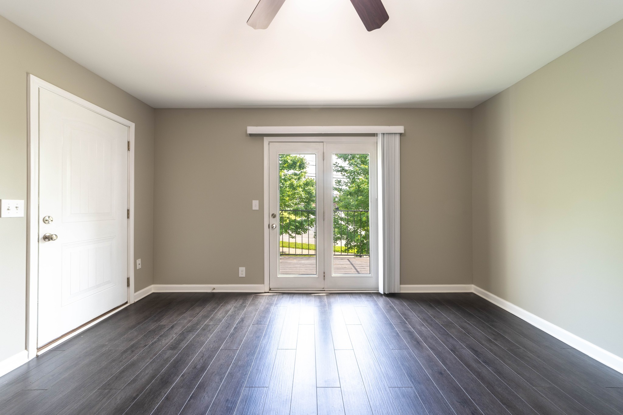 311 Hawkins Road, Unit H7 Clarksville, TN 37040 - Photo 3 of 15 a view of an empty room with wooden floor and a window